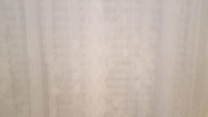 Window lace curtains and fabric blinds.