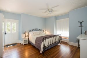 The Delphinium guest room with king bed.