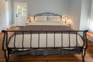 The Delphinium guest room with king bed.