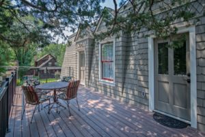 The finished South deck complete with patio furniture. The Delphinium and Laurel rooms have access to the deck.
