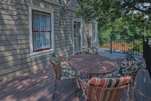 The finished South deck complete with patio furniture. The Delphinium and Laurel rooms have access to the deck.