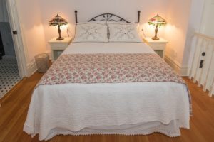 The Rose guest room with a queen bed.