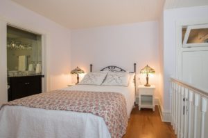 The Rose guest room with a queen bed.